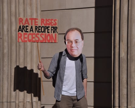 Activist wearing Andrew Bailey mask protests against interest rates outside Bank of England.