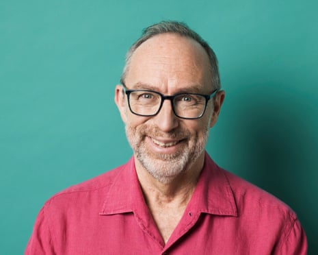 Jimmy Wales: ‘I’m just a geek.’ Portrait of Jimmy Wales in pink shirt against a blue/green background
