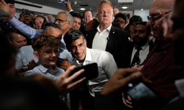 Rishi Sunak poses for pictures with supporters during a party rally in Amersham in Buckinghamshire.