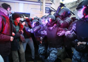 Protesters clash with police at a rally in support of jailed opposition leader Alexei Navalny in St Petersburg, Russia