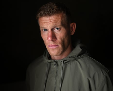 Footballer James McClean, wearing an olive green jacket, has a serious expression