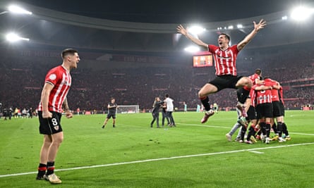 Athletic Bilbao’s players celebrate after ending their wait for the Copa del Rey title.