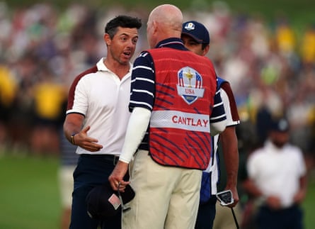 Rory McIlroy argues with Joe LaCava, caddie of Patrick Cantlay, on the 18th hole during the Ryder Cup.