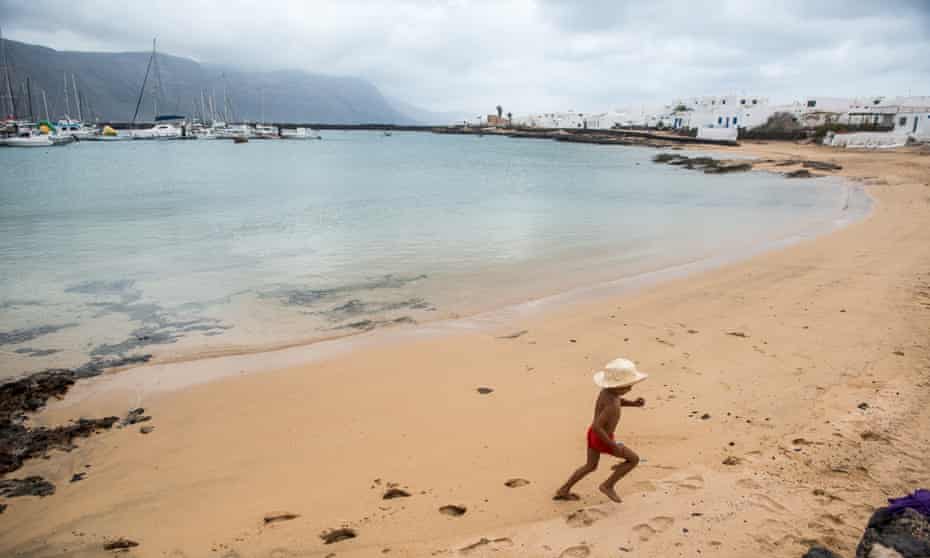 A child plays in the deserted Caleta de Sebo beach, in La Graciosa, Canary islands, Spain, last week.
