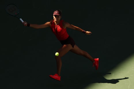 Emma Raducanu runs into the shade for a forehand.