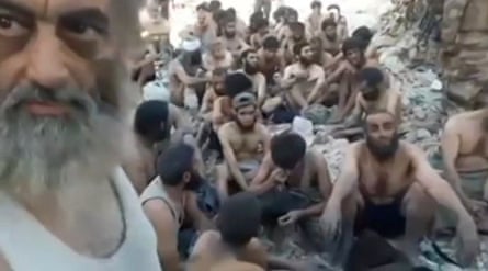A still from a video showing Islamic State militants who surrendered in Mosul’s old city on 13 July.