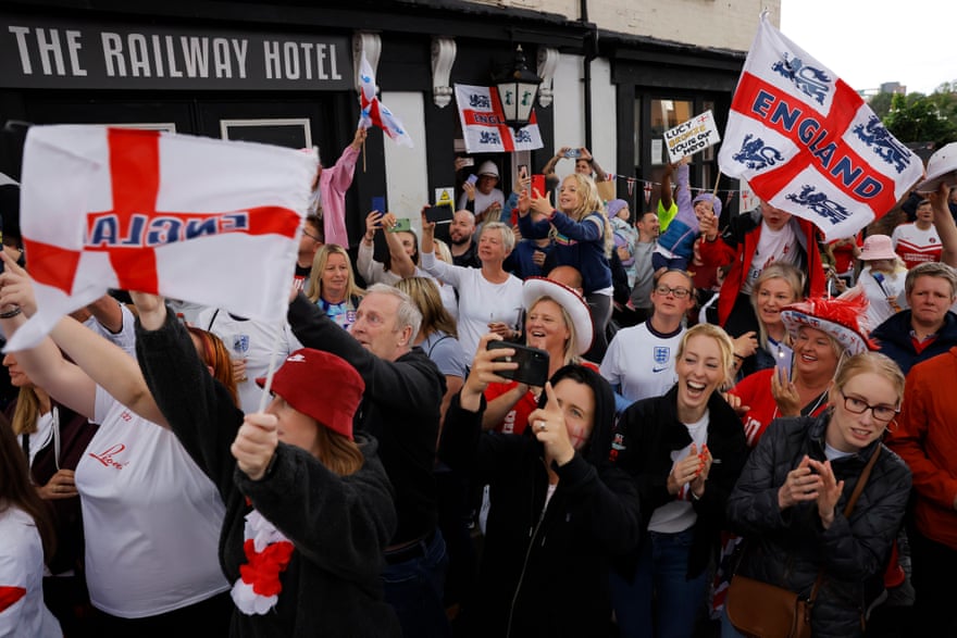 England fans cheer as the England coach goes past ahead of the Women’s Euro 2022 semi-final between England and Sweden.
