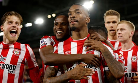 Ivan Toney is embraced by his teammates after doubling Brentford’s lead from the spot