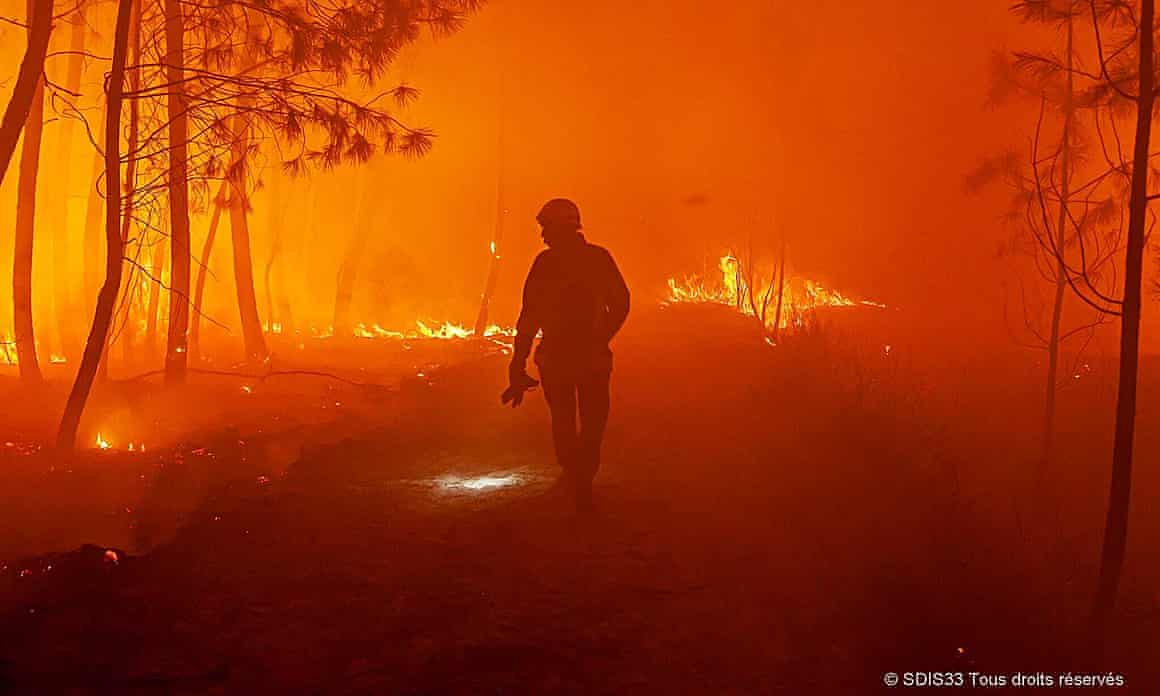 Firefighter during a wildfire near Landiras, south-west France, in July 2022.