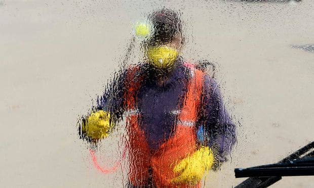A worker sprays disinfectant on a Delhi Transport Corporation bus as a precautionary measure against spread of Covid-19.