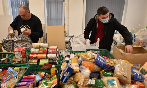 Volunteers at a soup kitchen in Blackpool make food parcels.