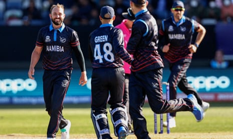 Jan Frylinck celebrates with teammates after taking a wicket