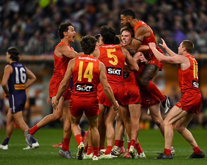 Gold Coast sink Fremantle in wild ending to claim club’s first AFL finals win