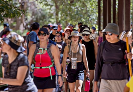 Visitors make their way toward the popular Narrows hike in Zion national park.