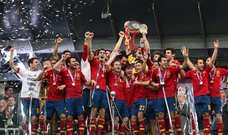 Spain’s captain Iker Casillas (centre) lifts the trophy amidst his celebrating teammates after their victory over Italy in the 2012 Euro Championship final.