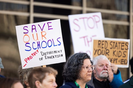 Civil servants and supporters of the education department rally outside the department in Washington DC, on Tuesday.