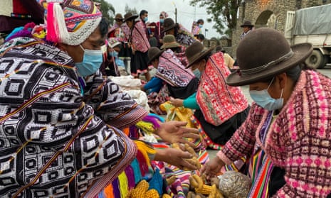 The chalay – or exchange – of maize and ullucus at a barter market at Choquecancha, Peruvian Andes. 