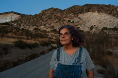 Local activist Rosa María Fernández at the Aquadeus water-bottling plant in Dúrcal, Spain