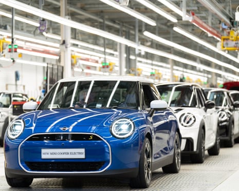 Shiny blue and white cars on the production line