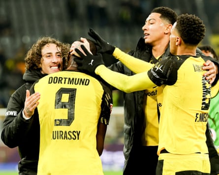 Fábio Silva, Jobe Bellingham and Felix Nmecha congratulate Serhou Guirassy (No 9) after the striker ended his goal drought