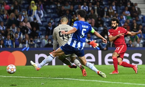 Mohamed Salah of Liverpool scores their third goal past Diego Costa of Porto.