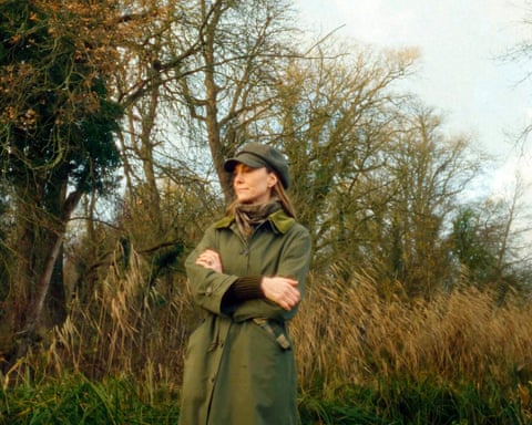 Princess of Wales wearing winter clothing in a countryside setting.