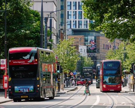 Double-decker buses and tram tracks on Broad Street near the Five Ways entertainment complex in Birmingham.