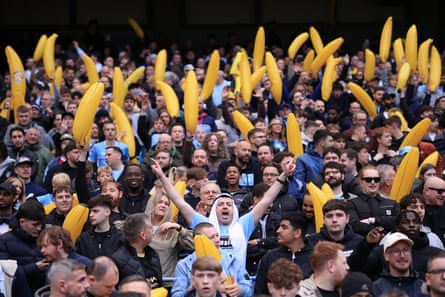 Manchester City fans hold up their inflatable bananas
