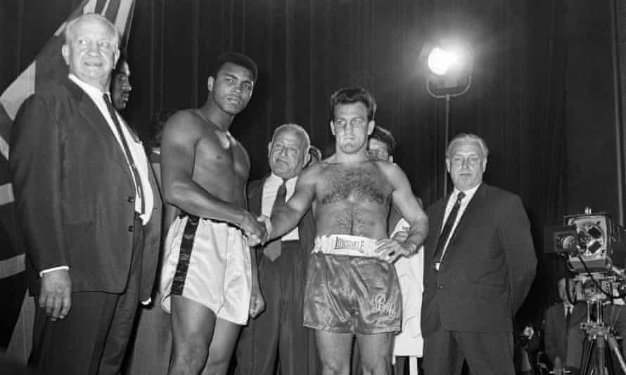 Muhammad Ali and Brian London weigh in for the August 1966 fight.