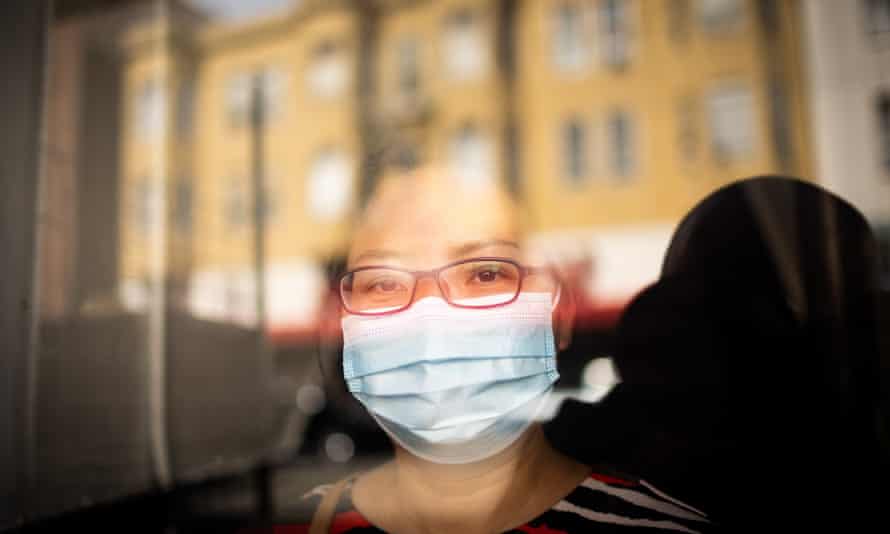 Yan Yu Lin poses for a portrait in front of her apartment building where she struggles with substandard plumbing in San Francisco’s Chinatown on August 2, 2021.