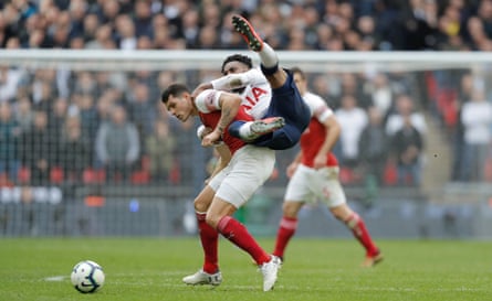 Granit Xhaka gets tangled up with Danny Rose.