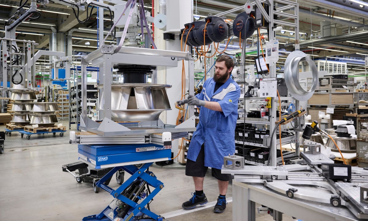 German industrial workers in a manufacturing plant