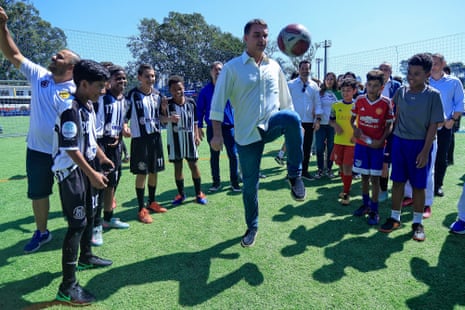 The right-wing presidential candidate Flávio Bolsonaro plays with a football
