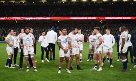 England players stand dejected after defeat to Ireland.