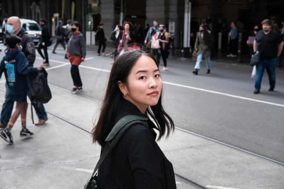 Yenny Seo  with pedestrians on the street with pedestrians