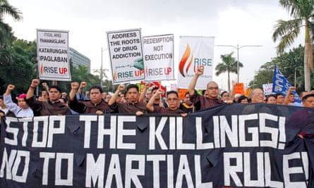 Protesters stage a protest rally against extrajudicial killings.
