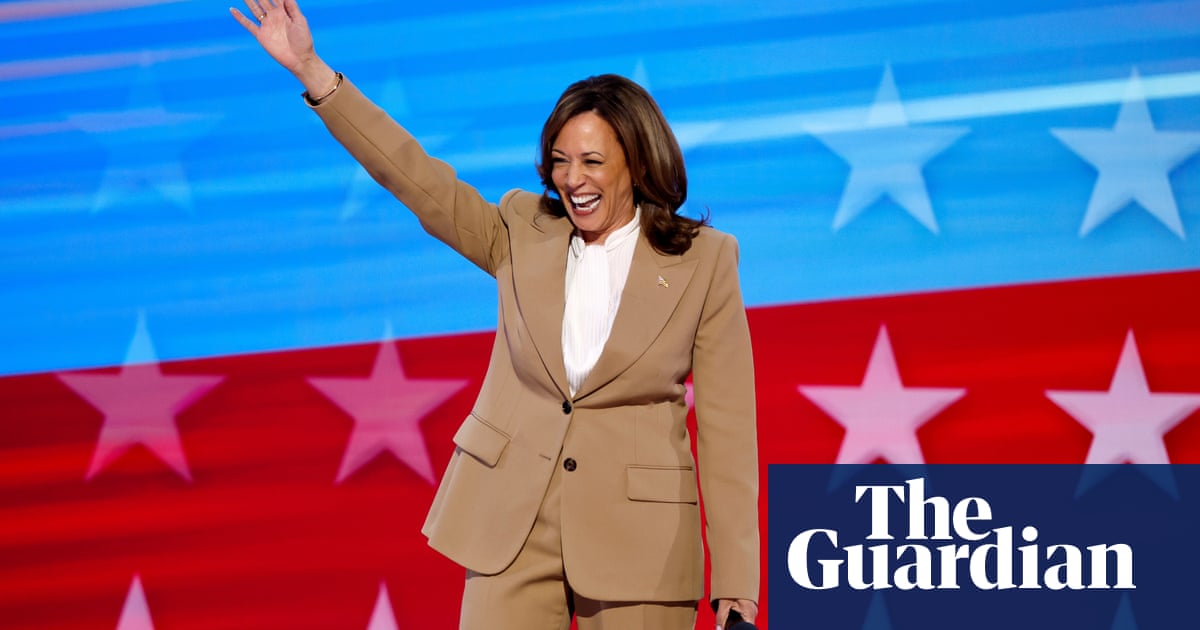 Kamala Harris makes surprise DNC appearance, praising Joe Biden – video | US politics | The Guardian