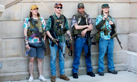 Armed protesters demonstrate outside the Michigan State Capitol in Lansing, 20 May 2020.