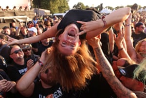 Wacken, Germany: a reveller surfs on top of the crowd during the Open Air heavy metal festival
