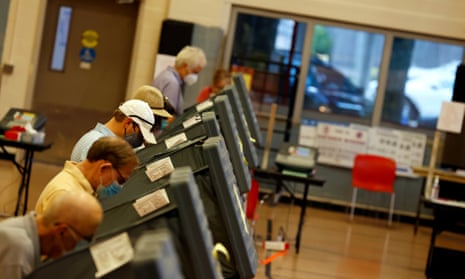 Voters cast their ballots at an early voting polling location in Houston, Texas, on 15 October 2020.