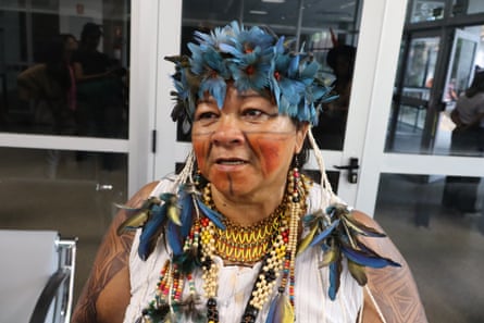 woman wearing a blue feathered headdress