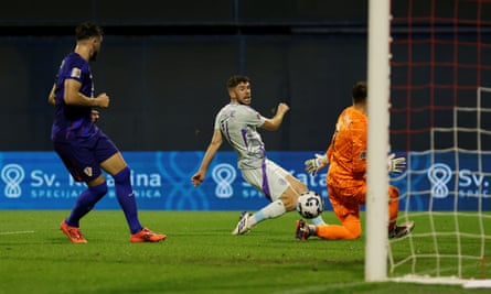 Ryan Christie scores past Dominik Livakovic.
