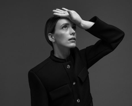 Actor Stacy Martin with her hand on her brow