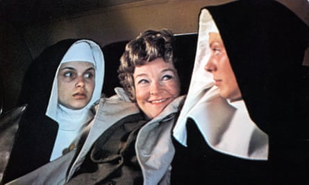 Beryl Reid sits between two nuns in a scene from the film The Killing Of Sister George, 1968.