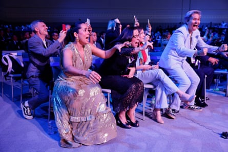 Delegates from Brazil celebrate after Brazil are announced as the host country for the 2027 Women’s World Cup