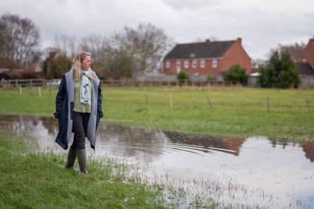 Bryony Sadler, pictured by her home in Moorland, Somerset as the water levels rise.
