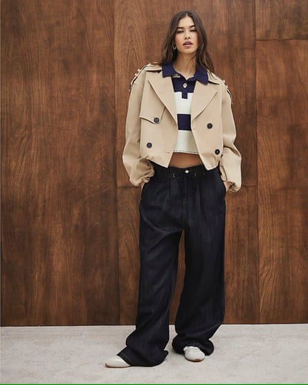 A model wearing beige short bubble-hem trench coat