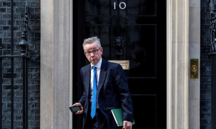 Michael Gove in a suit and tie photographed leaving 10 Downing Street