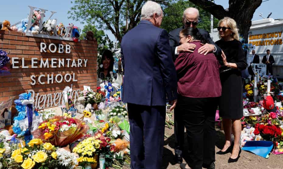 President Joe Biden embraces Mandy Gutierrez, principal at Robb elementary school, where a gunman killed 19 children and two teachers, as first lady Jill Biden stands next to him, in Uvalde, Texas, on Sunday.