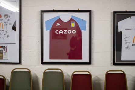 An Aston Villa shirt signed by Ollie Watkins hangs in the clubhouse